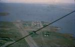 <span class="caption-caption">Cuddapan station isolated by floods, from a Tiger Moth, Diamantina Shire</span>, 1974. <br />Slide, collection of <span class="caption-contributor">Dennis Costigan</span>.