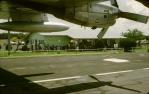 <span class="caption-caption">December 1974 refugees from Darwin cyclone Tracy waiting to embark for Sydney on an RAAF C-130 Hercules. Due to engine failure of the aircraft transporting them from Darwin, they had stayed overnight in Charleville</span>, 1974. <br />Slide, collection of <span class="caption-contributor">Dennis Costigan</span>.