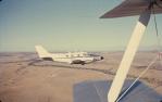 <span class="caption-caption">Over Cuddpan Station in winter, very cold in the open cockpit of Tiger Moth, Diamantina Shire</span>, 1974. <br />Slide, collection of <span class="caption-contributor">Dennis Costigan</span>.
