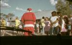 <span class="caption-caption">Santa with Indigenous community at the Birdsville hospital, Diamantina Shire</span>, 1975. <br />Slide, collection of <span class="caption-contributor">Dennis Costigan</span>.