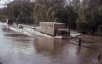 <span class="caption-caption">People paying semi-trailer driver to cross Funnel Creek, Sarina</span>, 1974. <br />Slide, collection of <span class="caption-contributor">Doug Rumsey</span>.