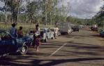 <span class="caption-caption">Queue at flooded Funnel Creek, Sarina</span>, 1974. <br />Slide, collection of <span class="caption-contributor">Doug Rumsey</span>.