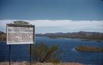<span class="caption-caption">Lake Corella with Rio Tinto sign, Mary Kathleen</span>, 1960. <br />Slide, collection of <span class="caption-contributor">Edward Robertson</span>.