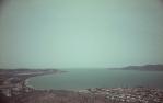 <span class="caption-caption">Rowes Bay seen from Castle Hill</span>, 1975. <br />Slide, collection of <span class="caption-contributor">John Donohue</span>.