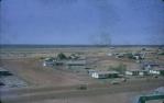 <span class="caption-caption">In the middle of the road is the town well, which supplied water for the powerhouse, using a pump. Most houses had their own well, some with electric pumps and others with windmills, Normanton</span>, 1973. <br />Slide, collection of <span class="caption-contributor">John Hindmarsh</span>.