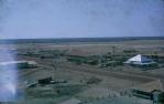 <span class="caption-caption">Hotel in centre, high-roofed Bank of NSW on right and on the left a tent for travellers to stay in, behind the Country Women's Association cottage, Normanton</span>, 1973. <br />Slide, collection of <span class="caption-contributor">John Hindmarsh</span>.