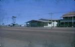 <span class="caption-caption">The old, red-roofed School of Arts, the new School of Arts and, in front of the water tower, the slant-roofed cottage for CWA (Country Women's Association) meetings, Normanton</span>, 1973. <br />Slide, collection of <span class="caption-contributor">John Hindmarsh</span>.