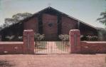 <span class="caption-caption">St Pauls Anglican Church, with rose garden, Talwood. The interior was decorated with wood inlay by Gordon Black</span>, 1965. <br />Slide, collection of <span class="caption-contributor">Jim McDougall</span>.