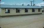 <span class="caption-caption">Agents' offices at saleyards, Kingaroy</span>, c1950s. <br />Slide, collection of <span class="caption-contributor">John Thun</span>.