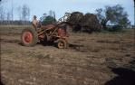 <span class="caption-caption">Two stooks on hydro-loader, Kingaroy Shire</span>, 1956. <br />Slide, collection of <span class="caption-contributor">John Thun</span>.