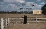 <span class="caption-caption">Beyond the Black Stump, gateway to Mundubbera</span>, 1956. <br />Slide, collection of <span class="caption-contributor">John Thun</span>.