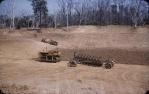 <span class="caption-caption">Building a tank (dam) with 8 furrow Majestic plough in foreground, Durong</span>, c1955. <br />Slide, collection of <span class="caption-contributor">John Thun</span>.