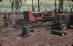 <span class="caption-caption">Building a "tree spear" on dozer in the bush, Durong</span>, c1958. <br />Slide, collection of <span class="caption-contributor">John Thun</span>.