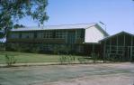 <span class="caption-caption">Entrance and G block, high school, Charleville</span>, 1964. <br />Slide, collection of <span class="caption-contributor">Lynne Cain</span>.