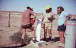 <span class="caption-caption">Constructing plinth and plaque to celebrate joint centenary of Royal Geographical Society of Australasia at Haddon Corner, Barcoo Shire</span>, 1985. <br />Slide, collection of <span class="caption-contributor">Marie Hayes</span>.