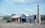 <span class="caption-caption">Buildings on mine site, Ravenswood</span>, c1980s. <br />Slide, collection of <span class="caption-contributor">Marie Hayes</span>.