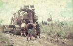 <span class="caption-caption">Loading telecommunication cable into plough shute, Banana Shire</span>, 1975. <br />Slide, collection of <span class="caption-contributor">Neville Sim</span>.