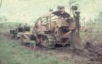 <span class="caption-caption">Laying telecommunication cable from D7 tractor, Banana Shire</span>, 1975. <br />Slide, collection of <span class="caption-contributor">Neville Sim</span>.