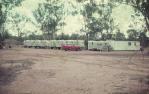 <span class="caption-caption">Caravans provided PMG (Postmaster-General) workers' accommodation while telecommunication cables were laid in the area, Moura</span>, 1975. <br />Slide, collection of <span class="caption-contributor">Neville Sim</span>.