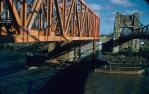 <span class="caption-caption">Steel masts supported the end of the span of new rail bridge as it was floated out at high tide, Indooroopilly</span>, 1957. <br />Slide, collection of <span class="caption-contributor">Oswald  Endacott</span>.