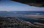 <span class="caption-caption">Aerial view of the Spit and the Broadwater, Southport</span>, 1957. <br />Slide, collection of <span class="caption-contributor">Patrick Conaghan</span>.