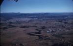 <span class="caption-caption">Aerial view above Archerfield Airport</span>, 1959. <br />Slide, collection of <span class="caption-contributor">Patrick Conaghan</span>.