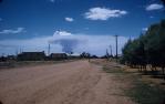 <span class="caption-caption">Feather Street, Roma with bushfire  in distance</span>, c1959. <br />Slide, collection of <span class="caption-contributor">Patrick Conaghan</span>.
