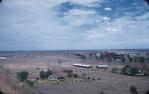 <span class="caption-caption">Roma view toward from top of water-tower on Hospital Hill; Roma show-grounds and associated pavilions in centre and right is the Roma Base Hospital</span>, c1959. <br />Slide, collection of <span class="caption-contributor">Patrick Conaghan</span>.