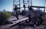 <span class="caption-caption">“Narraburra” property, Roma district, site of the Roma Blocks Oil Company’s petroleum-exploration well 1941, the abandoned derrick of this well was subsequently dismantled and reassembled at the Roma Tourist Information Centre in 1990 as The Big Rig</span>, 1959. <br />Slide, collection of <span class="caption-contributor">Patrick Conaghan</span>.