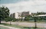 <span class="caption-caption">The General Hospital at Townsville, with L-shaped new nurses quarters behind. The two storey wooden building in the centre is the old  Townsville hospital, demolished soon after this photograph was taken</span>, 1958. <br />Slide, collection of <span class="caption-contributor">Peter Petersen</span>.