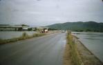 <span class="caption-caption">Ross River in flood at Bowen Bridge road, with Queenland Meat Export (QME) meatworks, demolished in 1996</span>, 1958. <br />Slide, collection of <span class="caption-contributor">Peter Petersen</span>.