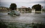 <span class="caption-caption">Flooded Charters Towers road near bowls club, Townsville</span>, 1958. <br />Slide, collection of <span class="caption-contributor">Peter Petersen</span>.