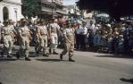 <span class="caption-caption">Members of the 9th Field Ambulance brigade, marching on Anzac Day at the intersection of Flinders and Denham Streets, Townsville</span>, 1958. <br />Slide, collection of <span class="caption-contributor">Peter Petersen</span>.