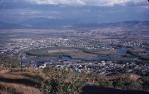 <span class="caption-caption">View over Hermit Park and Railway Estate from Castle Hill, Townsville. The large empty area at centre now houses the Civic Theatre, Town State High School, Boundary Road and the first V8 Super Car race track in Townsville</span>, 1958. <br />Slide, collection of <span class="caption-contributor">Peter Petersen</span>.
