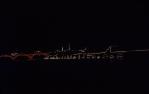 <span class="caption-caption">William Jolly Bridge and small boats illuminated for Expo 1988, Toowong Reach</span>, 1988. <br />Slide, collection of <span class="caption-contributor">Robert Ball</span>.