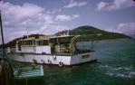 <span class="caption-caption">Glass bottomed boat, the Aircloud in Happy Bay</span>, 1974. <br />Slide, collection of <span class="caption-contributor">Ruth Read</span>.