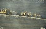 <span class="caption-caption">Coal trucks, Coal mines, Blackwater</span>, 1979. <br />Slide by <span class="caption-publisher">Michael Keniger</span>, collection of <span class="caption-contributor">University of Queensland Library</span>.