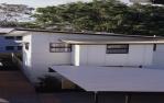 <span class="caption-caption">South (front) elevation, public housing, Cotton Tree Housing Estate, Maroochydore</span>, 1996. <br />Slide by <span class="caption-publisher">Michael Keniger</span>, collection of <span class="caption-contributor">University of Queensland Library</span>.