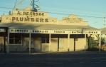 <span class="caption-caption">Street elevation, A. Pearson Plumbers shop, Rockhampton</span>, 1979. <br />Slide by <span class="caption-publisher">Michael Keniger</span>, collection of <span class="caption-contributor">University of Queensland Library</span>.