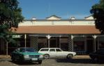<span class="caption-caption">Shopfronts, Childers</span>, 1986. <br />Slide by <span class="caption-publisher">Michael Keniger</span>, collection of <span class="caption-contributor">University of Queensland Library</span>.