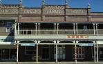 <span class="caption-caption">Street elevation, Hunter's Queen's Arms Hotel, Roma</span>, 1986. <br />Slide by <span class="caption-publisher">Michael Keniger</span>, collection of <span class="caption-contributor">University of Queensland Library</span>.