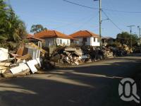 <span class="caption-caption">Flood clean up in Graceville street, 17 January 2011</span>. <br />Digital image, collection of <span class="caption-contributor">Rachel Bastin</span>.