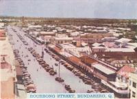 <span class="caption-caption">Bourbong Street, Bundaberg</span>, c1938. <br />Postcard folder by <span class="caption-publisher">Murray Views Pty Ltd</span>, collection of <span class="caption-contributor">Centre for the Government of Queensland</span>.