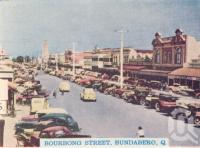 <span class="caption-caption">Bourbong Street, Bundaberg</span>, c1938. <br />Postcard folder by <span class="caption-publisher">Murray Views Pty Ltd</span>, collection of <span class="caption-contributor">Centre for the Government of Queensland</span>.