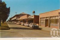 <span class="caption-caption">Shamrock Street, Blackall</span>, c1964. <br />Postcard folder by <span class="caption-publisher">Sydney G Hughes Pty Ltd</span>, collection of <span class="caption-contributor">Centre for the Government of Queensland</span>.