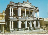 <span class="caption-caption">The old Australian Bank of Commerce, Charters Towers</span>, c1972. <br />Postcard folder by <span class="caption-publisher">Murray Views Pty Ltd</span>, collection of <span class="caption-contributor">Centre for the Government of Queensland</span>.