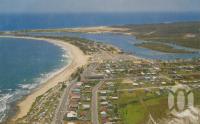 <span class="caption-caption">Surfing beach, Esplanade and Mooloolah River. Note camping grounds on both sides of Parkyn Parade, no high rise on Mooloolaba Esplanade and fibro cinema still in place.</span>, c1966. <br />Postcard by <span class="caption-publisher">Bernard Kuskopf</span>, collection of <span class="caption-contributor">Centre for the Government of Queensland</span>.
