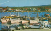 <span class="caption-caption">The Mooloolah River at this point provides safe anchorage for prawn trawlers and pleasure craft</span>, c1964. <br />Postcard by <span class="caption-publisher">Bernard Kuskopf</span>, collection of <span class="caption-contributor">Centre for the Government of Queensland</span>.