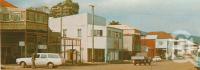 <span class="caption-caption">Charlotte Street, Cooktown</span>, c1964. <br />Postcard folder by <span class="caption-publisher">Unknown Publisher</span>, collection of <span class="caption-contributor">Centre for the Government of Queensland</span>.