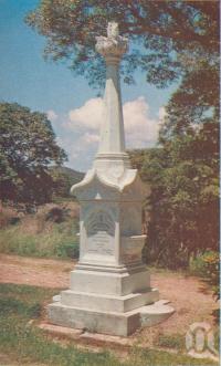 <span class="caption-caption">The Monument to Mrs Watson, Cooktown</span>, c1960. <br />Postcard folder by <span class="caption-publisher">Unknown Publisher</span>, collection of <span class="caption-contributor">Centre for the Government of Queensland</span>.